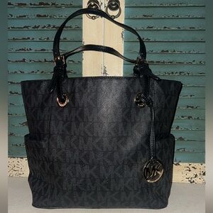 BlackMichael Kors Black Monogram Tote
Medium-large with side pockets